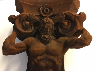 Very striking wall bracket -ornament with garing man, Polystone rest.